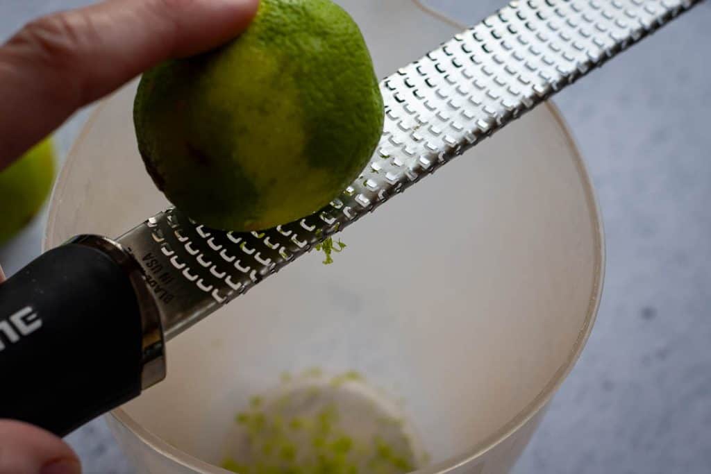 Zesting limes using microplane.