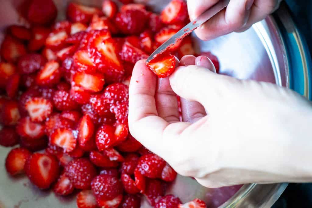 Slicing strawberries.