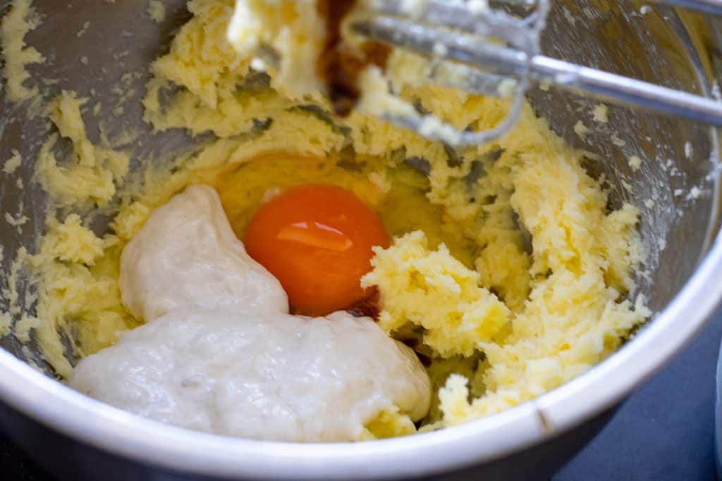 Adding wet ingredients to the butter mixture.
