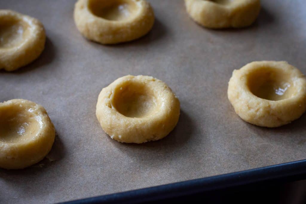 Shaped sourdough thumbprint cookies ready for chilling.