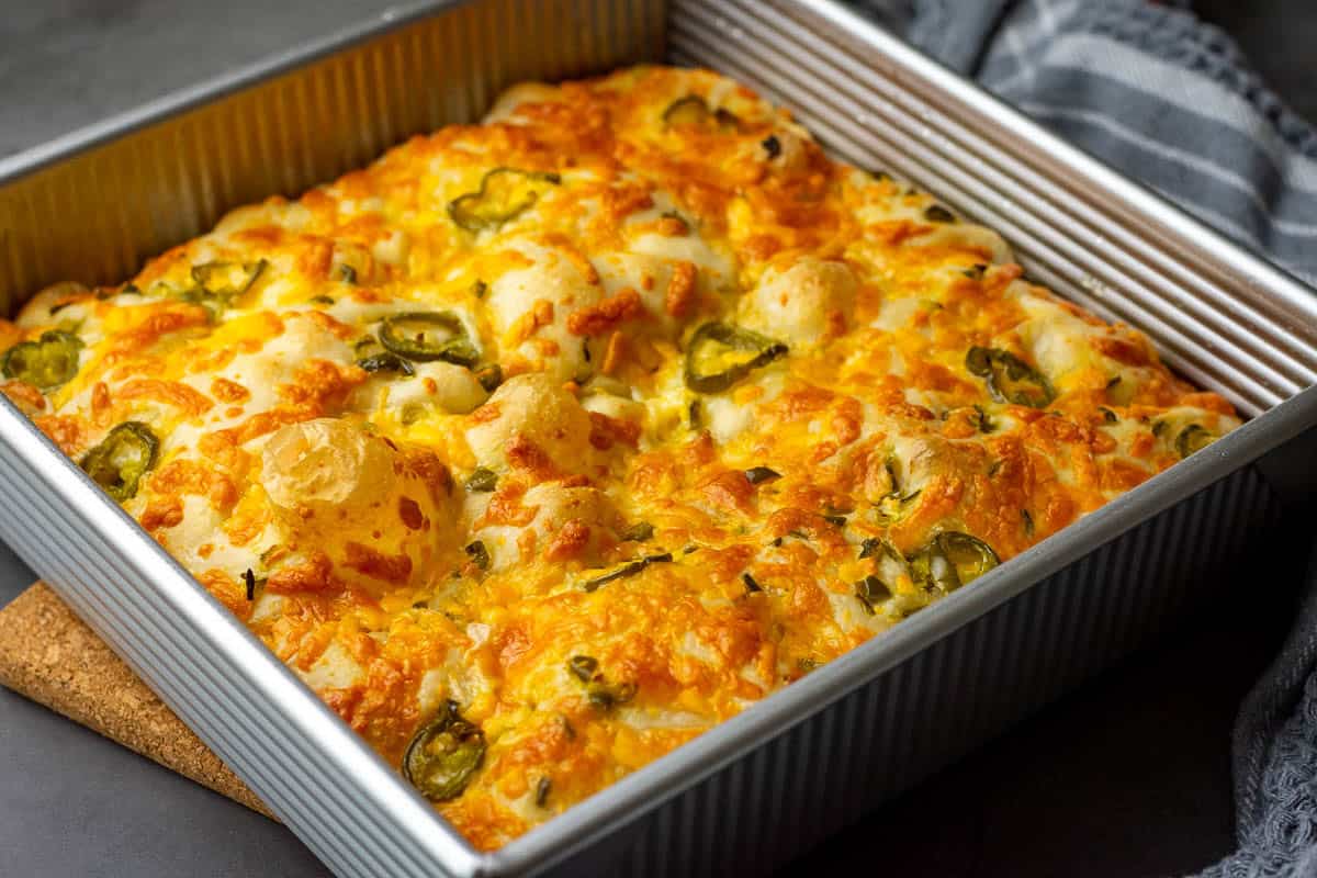 Baked jalapeno cheddar sourdough focaccia still in the baking tray.