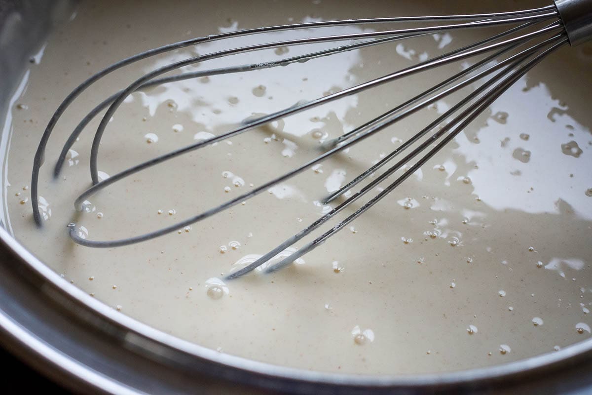 Whisking the batter wtha balloon whisk.