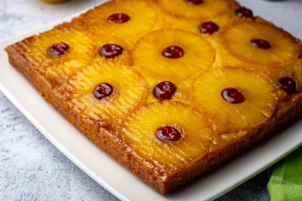 Inverted sourdough cake showing a beautiful pineapple and cherry pattern on top.