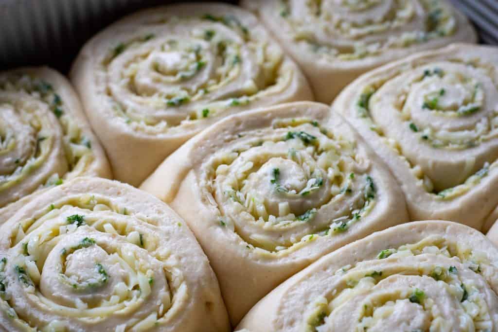 Puffy fully proofed sourdough garlic rolls.