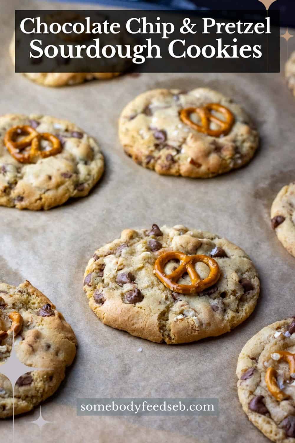 Chocolate chip and pretzel sourdough cookies on a baking sheet lined wih parchment paper. Pin for Pinterest.