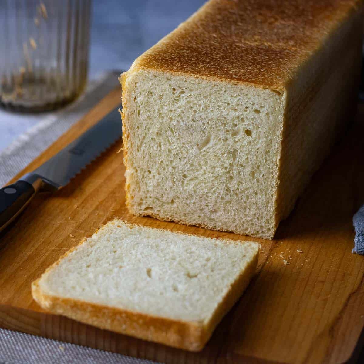 First slice cut from sourdough pullman loaf, also known as Sourdough pain de mie.