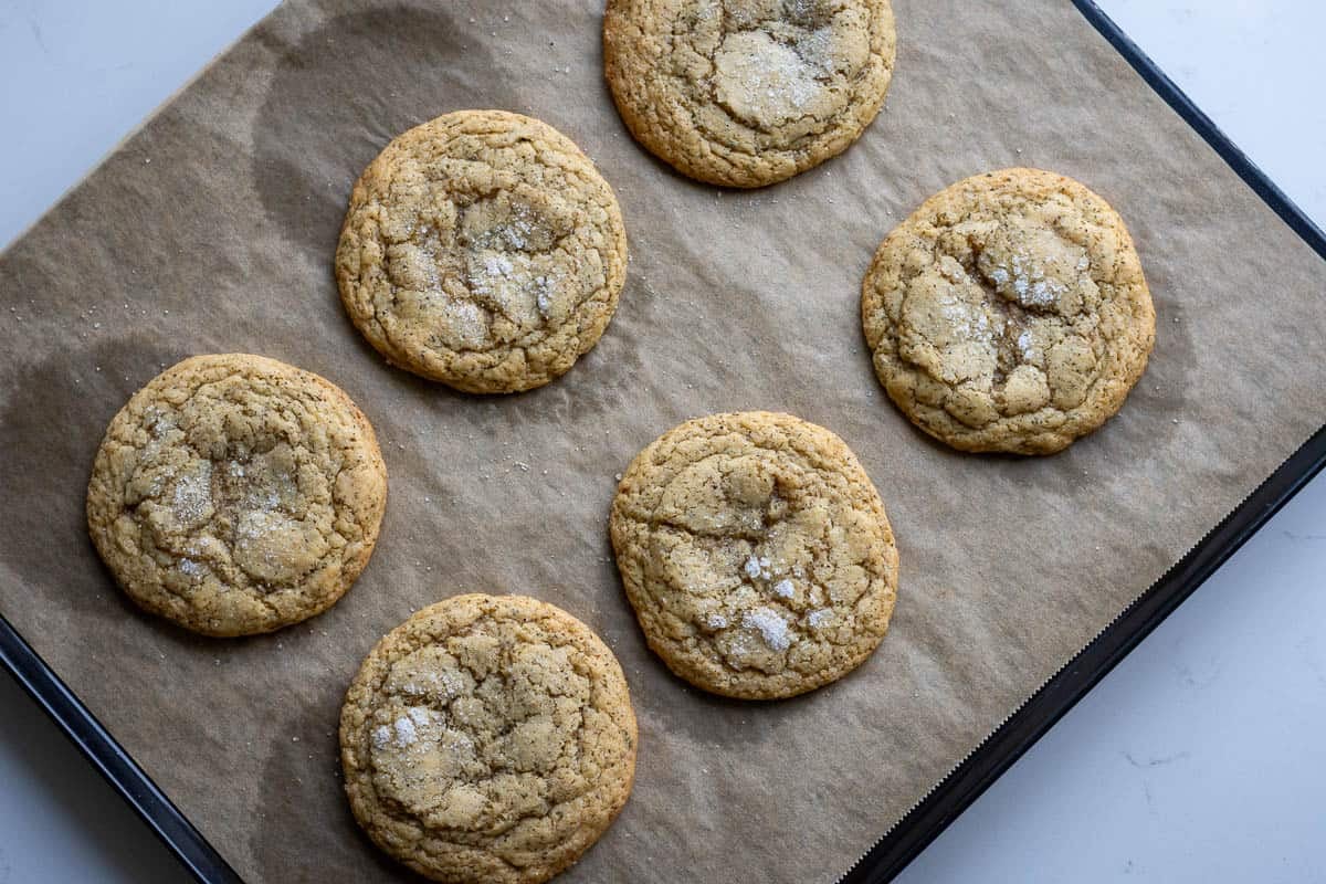 Baked sourdough cookies on a baking sheet.