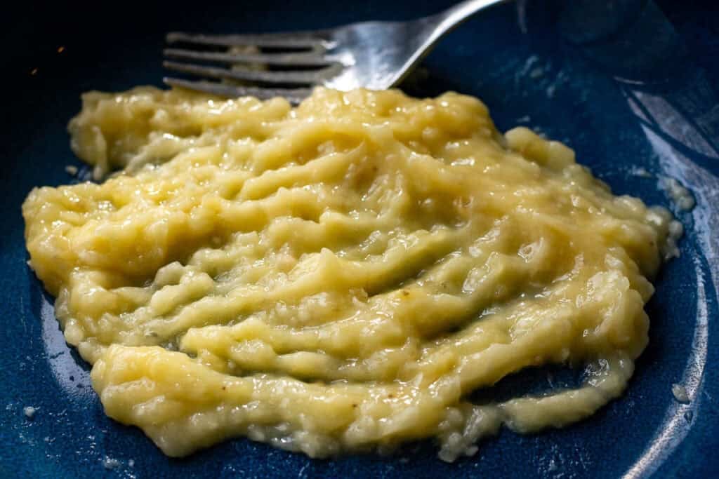 Banana puree in a blue bowl.