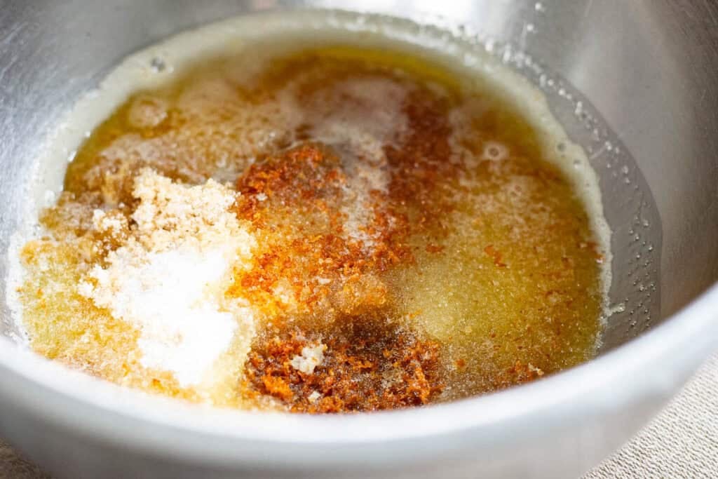 Browned butter poured over the granulated and brown sugar.