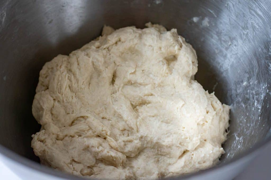 Sourdough fermentolysing in a bowl of a stand mixer.