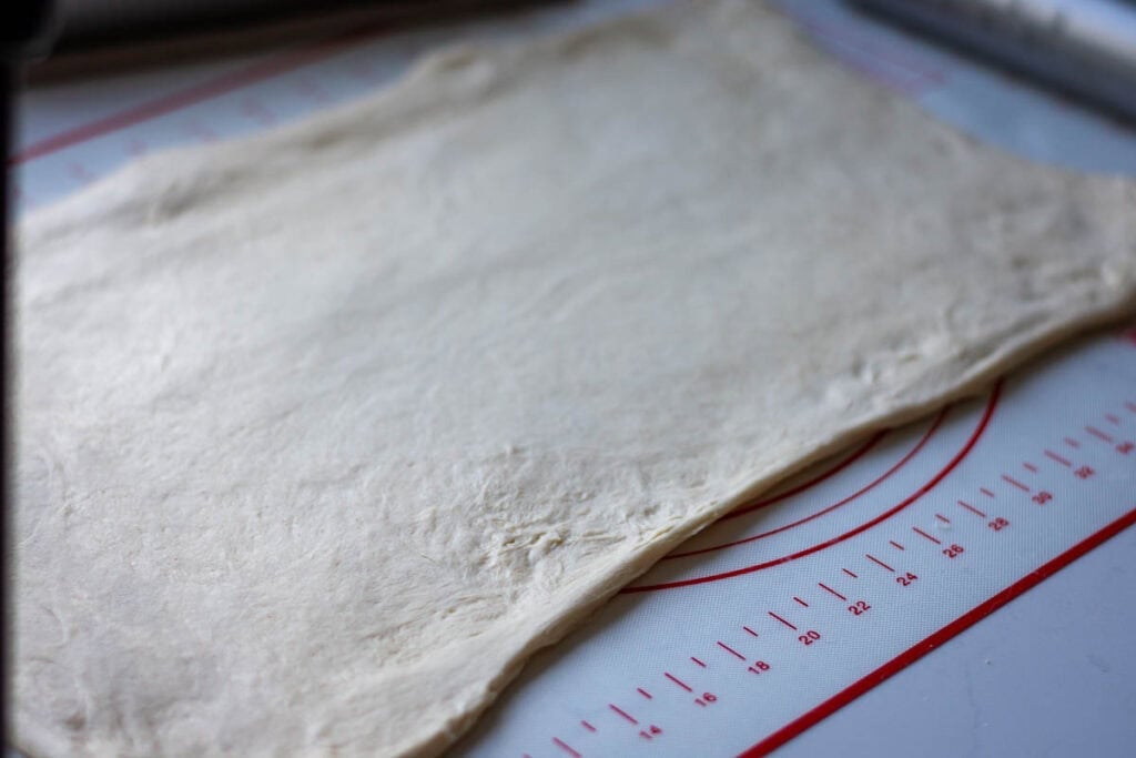 A large rectangle of rolled out sourdough.