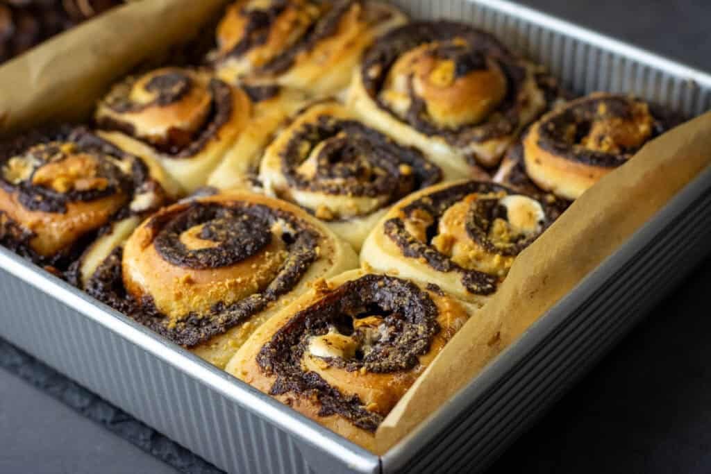 Chocolate filled sourdough rolls in a baking pan straight out of the oven.