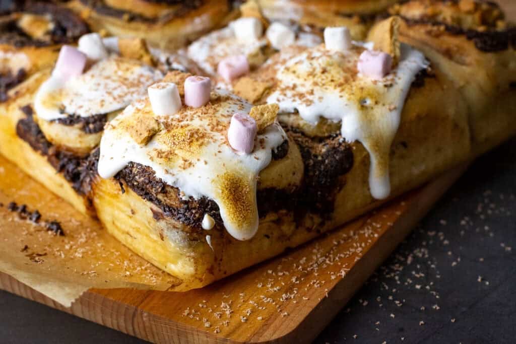 Sourdough S'mores Rolls with marshmallow fluff and mini marshmallows on top.