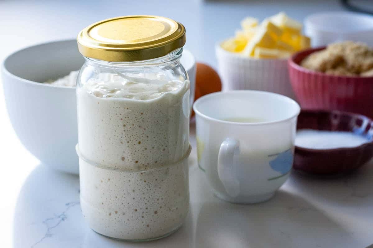 Active sourdough starter in a glass jar.