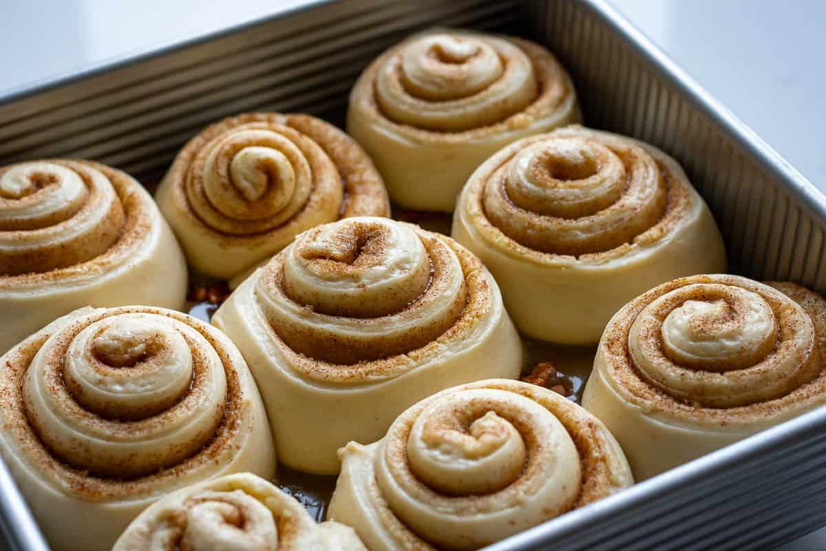 Maple pecan sourdough rolls in a square 9 inch pan.