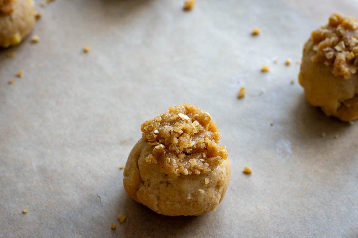 Oat crumb topping on a sourdough apple cookie dough ball.
