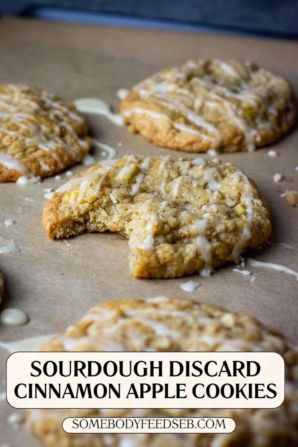 Sourdough apple cookies topped with oat rumb and drizzled with maple sugar glaze on a baking sheet. Pin for Pinterest.