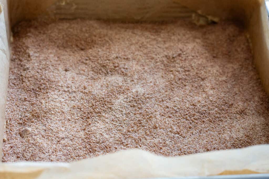 Cinnamon sugar layer scattered over the sourdough cake batter.
