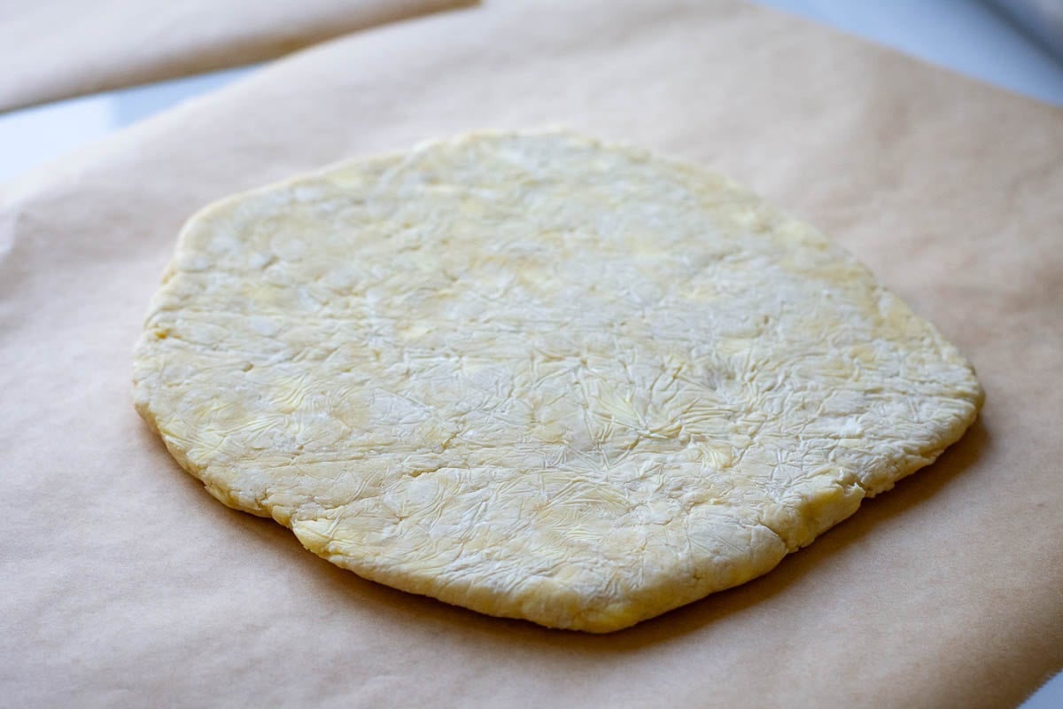 Sourdough discard pastry on a piece of parchment paper.