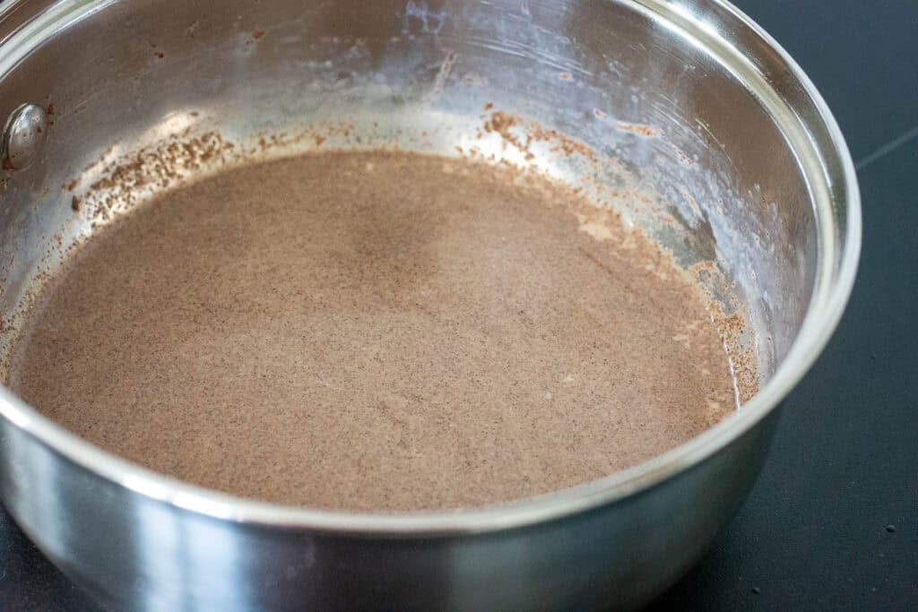 Spices blooming in warm milk.