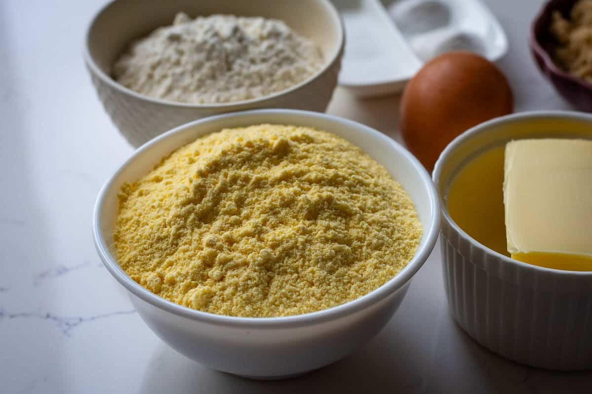 Fine cornmeal in a white bowl.