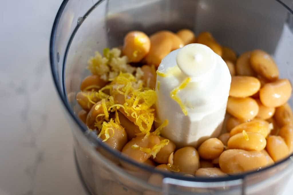 All Butter bean hummus ingredients in a food processor ready to be blitzed.